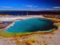 WEST THUMB GEYSER BASIN -- ABYSS POOL WITH YELLOWSTONE LAKE IN BACKGROUND