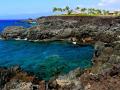 CORAL COVE - KONA, HAWAII - BLUE AND TURQUOISE WATER ARE A STRIKING CONTRAST AGAINST THE LAVA