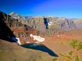 'GLACIAL CIRQUE LAKE' WITH LOTS OF IRON IN THE ROCKS WHICH GIVES THE RED COLOR - GLACIER NATIONAL PARK