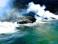"MOLTEN MAGMA" MEETS THE OCEAN - THIS IS A WIDE ANGLE SHOT WITH THE DOOR OPEN ON BELL407 HELICOPTER THE SMELL OF SULFUR AND THE HEAT WERE INTENSE - COPYRIGHT STEVE QUAYLE